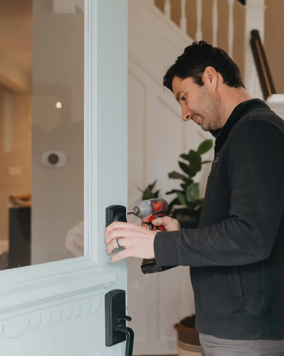 Paul Presson fixes an open front door on a PRP Properties rehab.